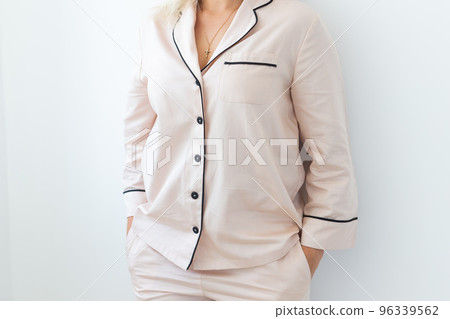 Close-up detail and fabric texture of a pajama. Homewear, sleepwear, shopping and sale 96339562