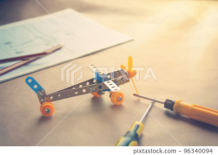 Toy iron plane with screwdrivers. Metal constructor. Dream, play and create 96340094