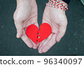 Divorce concept - Broken heart in the male hands. 96340097