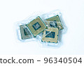 Computer processor CPU Central processing unit microchip isolated on white background Closeup the bottom side, socket contact for personal computer 96340504