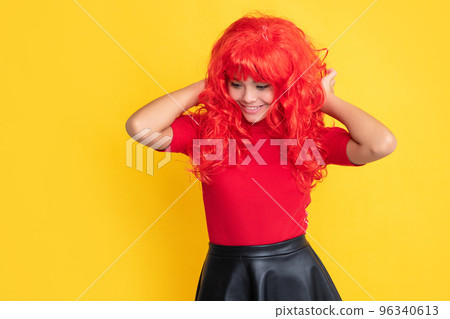 positive kid with red long hair on yellow background positive kid with red long hair on yellow background 96340613