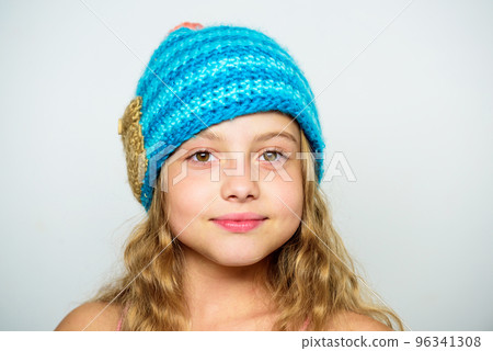Difference between knitting and crochet. Free knitting patterns. Fall winter season accessory. Childrens knitted hats. Girl long hair happy face white background. Kid wear warm soft knitted blue hat Difference between knitting and crochet. Free knitting patterns. Fall winter season accessory. Childrens knitted hats. Girl long hair happy face white background. Kid wear warm soft knitted blue hat 96341308
