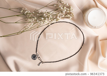 Handmade jewelry on a textile background. Gift for women. Bijouterie and jewellery for women 96341373