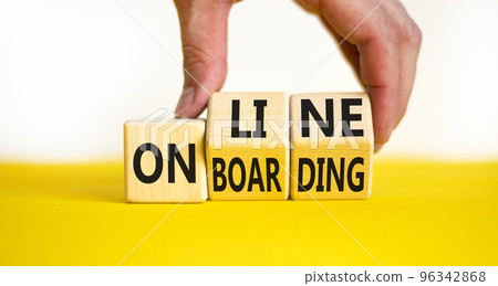 Online onboarding symbol. Concept words Online onboarding on wooden cubes. Businessman hand. Beautiful yellow table white background. Business and online onboarding concept. Copy space. 96342868