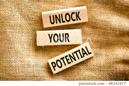 Unlock your potential symbol. Concept words Unlock your potential on wooden blocks. Beautiful canvas table canvas background. Business, psychological unlock your potential concept. Copy space. 96342877