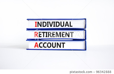 IRA individual retirement account symbol. Concept words IRA individual retirement account on books on beautiful white background. Business IRA individual retirement account concept. Copy space IRA individual retirement account symbol. Concept words IRA individual retirement account on books on beautiful white background. Business IRA individual retirement account concept. Copy space 96342888