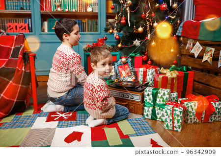 Christmas evening at family house. Happy brothers on holidays. 96342909