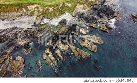 Rocks on the Irish shore, top view. The coast of the Atlantic Ocean. Nature of Northern Europe. Rocky coastline. Drone point of view. 96343043
