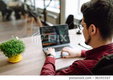 Close up picture of male hands working on her laptop. Social networking technology concept. 96343387