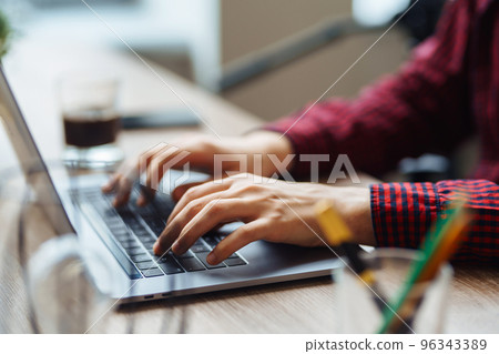 Close up picture of male hands working on her laptop. Social networking technology concept. 96343389
