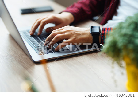 Close up picture of male hands working on her laptop. Social networking technology concept. 96343391