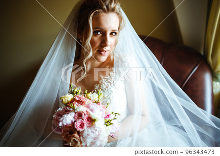 Gorgeous beauty young bride portrait. Morning of the bride. Beautiful bride in white wedding dress. Gorgeous beauty young bride portrait. Morning of the bride. Beautiful bride in white wedding dress. 96343473