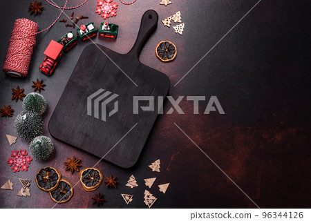 Beautiful different Christmas decorations and gingerbread on a brown concrete table 96344126