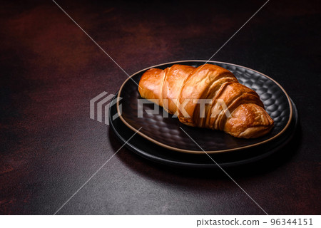 Beautiful different Christmas decorations and croissant on a brown concrete table 96344151