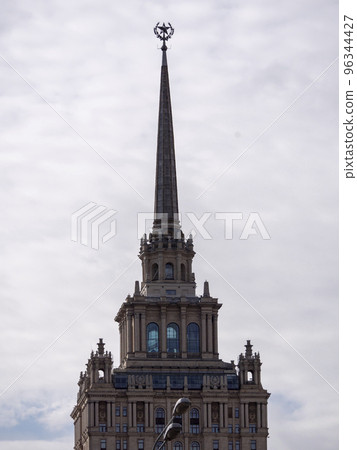 The spire of the hotel Ukraine against the sky in Moscow 96344427