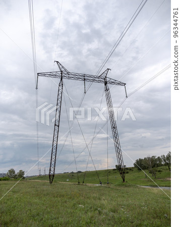 Concrete electric pole with wires against the sky 96344761