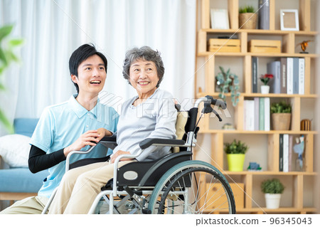 Elderly Man In Wheelchair Looking At Camera With A Blank Stare