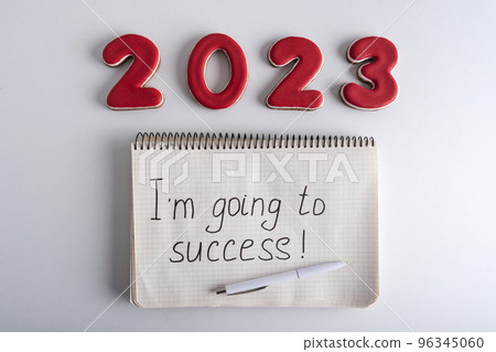 Numbers 2023 and notebook with the words I am going to success. Motivation for 2023. 96345060