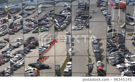 Reflection in the glasses of a modern shopping center building 96345145