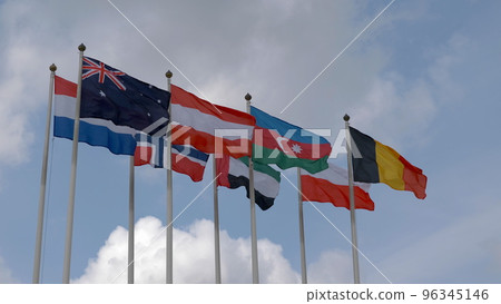 Various national flags with the EU flag under a blue sky. 96345146