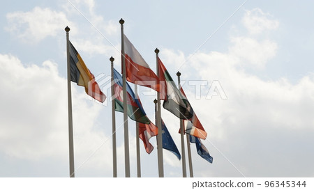 Various national flags with the EU flag under a blue sky. Various national flags with the EU flag under a blue sky. 96345344