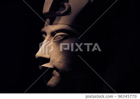 bust of pharaoh Echnaton (Akhenaten, aka Amenhotep IV) around black background . cloes up bust of pharaoh Echnaton (Akhenaten, aka Amenhotep IV) around black background . cloes up 96345770