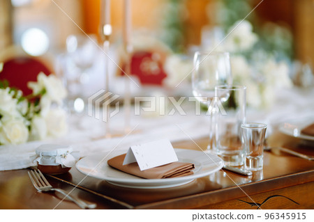 Beautiful table setting for a party, wedding reception or other festive event. Banquet setting, glasses, plates. 96345915