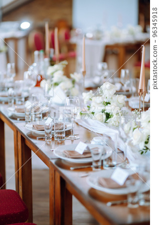 Beautiful table setting for a party, wedding reception or other festive event. Banquet setting, glasses, plates. 96345918