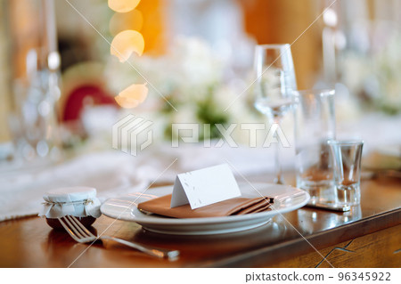 Beautiful table setting for a party, wedding reception or other festive event. Banquet setting, glasses, plates. 96345922