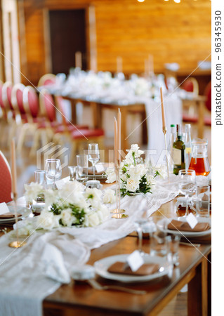 Beautiful table setting for a party, wedding reception or other festive event. Banquet setting, glasses, plates. 96345930