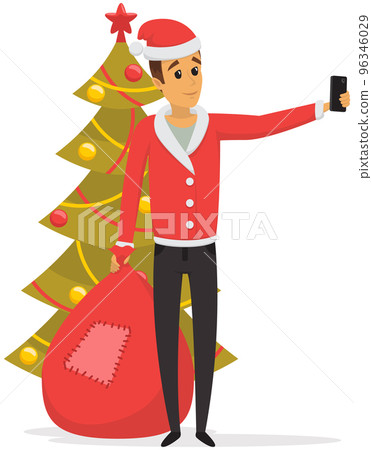Man in costume of Santa Claus taking selfie. Guy is posing for self portrait near Christmas tree 96346029