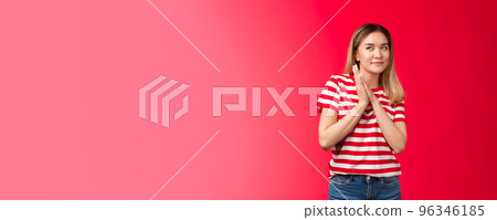 Smart and creative good-looking blond asian girl rubbing palms together devious and cunning have perfect plan, woman smirking curiously look up scheming have idea, stand red background 96346185