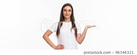 Waist-up portrait of pleasant good-looking caucasian female in glasses, attractive girl holding someone on hand, raising arm as have product on it, smiling camera, advertise, white background Waist-up portrait of pleasant good-looking caucasian female in glasses, attractive girl holding someone on hand, raising arm as have product on it, smiling camera, advertise, white background 96346321