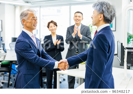 Business person shaking hands 96348217