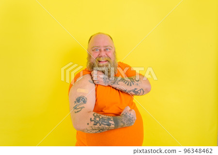 Happy man with beard and tattoos did the vaccine against covid-19 Happy man with beard and tattoos did the vaccine against covid-19 96348462