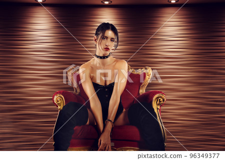 Sexy woman in lingerie and bdsm style in old armchair Sexy woman in lingerie and bdsm style in old armchair 96349377