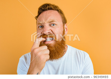 Doubter man with beard, tattoo and white t-shirt Doubter man with beard, tattoo and white t-shirt 96349493