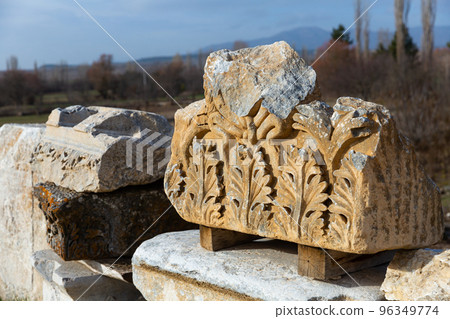 Antique sculptures fragments at archaeological site of Aizanoi, Turkey 96349774