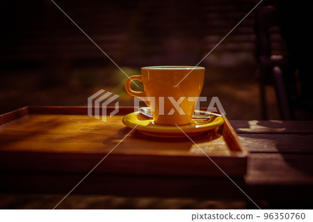 coffee cup on wooden desk 96350760