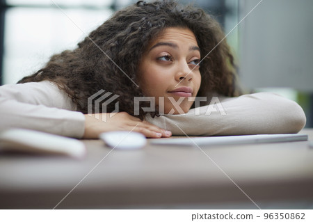 Tired overworked woman resting at workplace in office 96350862