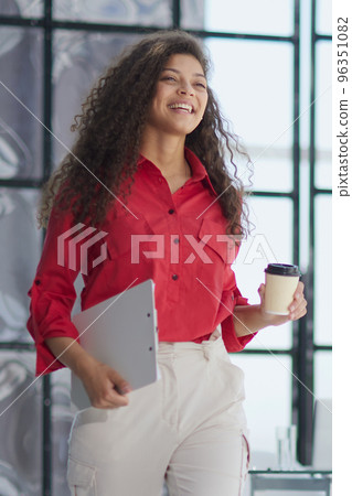 Good coffee to start a new day well. business woman in modern office 96351082