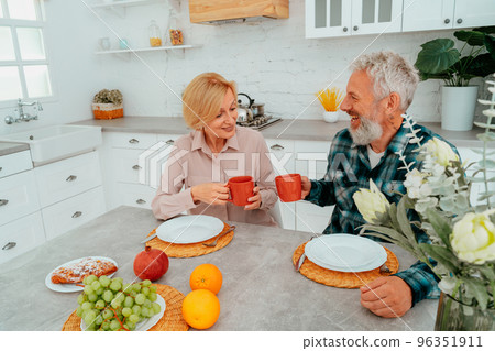 couple has breakfast at home with coffee and fruits couple has breakfast at home with coffee and fruits 96351911