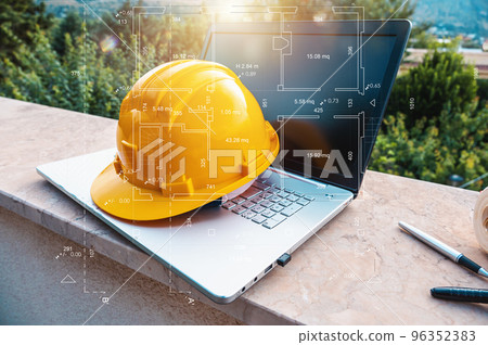 Laptop of a architect who plans a house 96352383