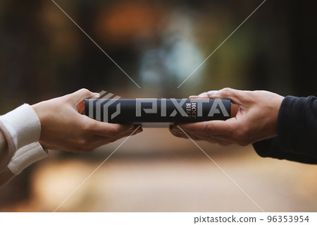 Christians who deliver Bibles on the streets and preach the gospel of Jesus Christ 96353954