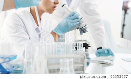 scientists are conducting research in a medical laboratory . 96353977