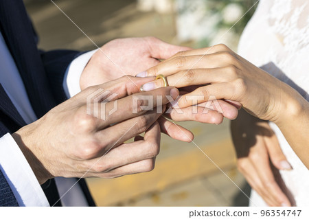Ring exchange at the wedding ceremony Ring exchange at the wedding ceremony 96354747