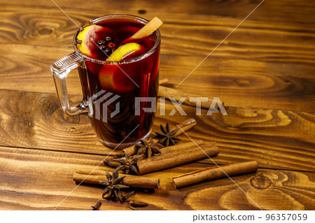 Mulled wine and spices on wooden table 96357059