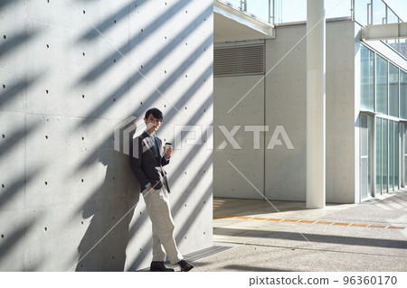 man holding a coffee cup man holding a coffee cup 96360170