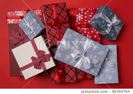 Group of gift boxes on red background. Group of gift boxes on red background. 96360764