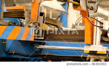 Corrugated Paper Box Factory. Manufacture of cardboard boxes. Large packs of sheets of cardboard are fed into the machine for the production of cardboard boxes. Footage with sound. Corrugated Paper Box Factory. Manufacture of cardboard boxes. Large packs of sheets of cardboard are fed into the machine for the production of cardboard boxes. Footage with sound. 96361002